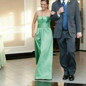Floor length, strapless gown with pockets